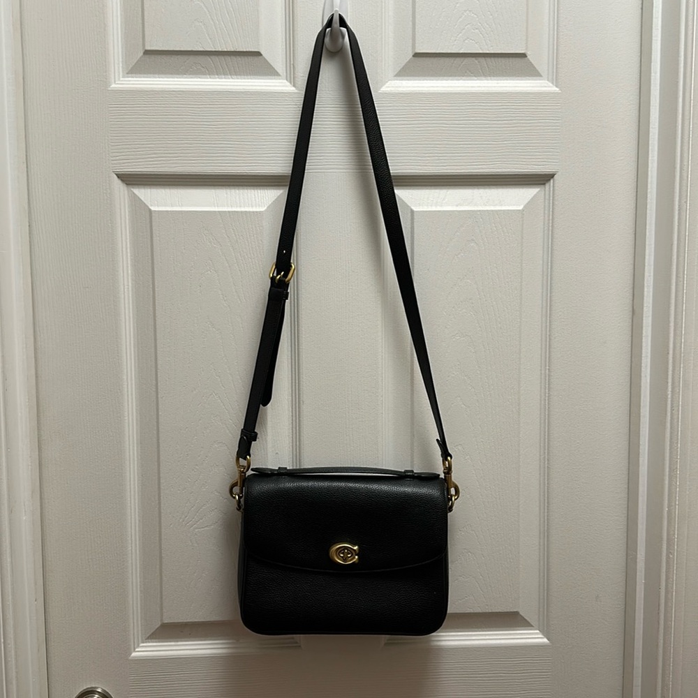 Coach black crossbody bag. Worn, in great condition. Gold hardware.